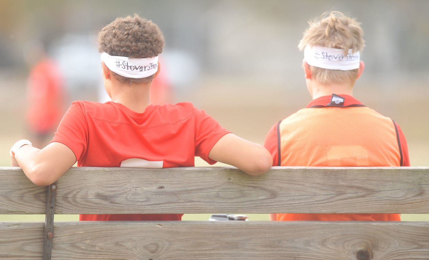 Laquey players wear “#StoverStrong” headbands on the bench during the Hornets’ match with the Bulldogs in Saturday’s Stover Classic semifinal.